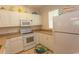 White kitchen with granite countertops and appliances at 601 N Hillside Dr. # 3634, North Myrtle Beach, SC 29582
