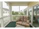 Enjoy this screened porch with wicker furniture and sliding glass door access at 601 N Hillside Dr. # 3634, North Myrtle Beach, SC 29582