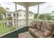 Relaxing screened porch with comfy wicker furniture and partial building view at 601 N Hillside Dr. # 3634, North Myrtle Beach, SC 29582