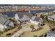 A waterfront home with a large yard and three-car garage at 6025 Bolsena Place, Myrtle Beach, SC 29577