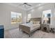 Spacious bedroom with light wood bed frame and serene water views at 6025 Bolsena Place, Myrtle Beach, SC 29577