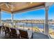 Spacious deck overlooking the water with wooden seating at 6025 Bolsena Place, Myrtle Beach, SC 29577