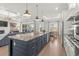 Open kitchen with large island, granite countertops, and stainless steel appliances at 6025 Bolsena Place, Myrtle Beach, SC 29577