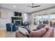 Cozy living room with fireplace and access to the outdoor patio at 6025 Bolsena Place, Myrtle Beach, SC 29577