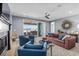 Bright living room with comfy seating and fireplace, opens to patio with water views at 6025 Bolsena Place, Myrtle Beach, SC 29577