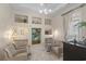 Cozy office with built-in shelves, comfortable armchairs, and artwork at 6025 Bolsena Place, Myrtle Beach, SC 29577
