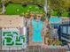 Aerial view of a resort featuring multiple pools, manicured lawns, and a mini-golf area at 7200 N Ocean Blvd. # 314, Myrtle Beach, SC 29572