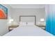 A well-lit bedroom with a queen bed, matching nightstands, and modern decor at 7200 N Ocean Blvd. # 314, Myrtle Beach, SC 29572