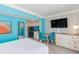 Bright condo kitchenette, dining area, and bedroom with beach-themed accents and a flat screen TV at 7200 N Ocean Blvd. # 314, Myrtle Beach, SC 29572