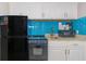 This efficient kitchenette boasts white cabinets, granite countertops, and stainless steel appliances at 7200 N Ocean Blvd. # 314, Myrtle Beach, SC 29572