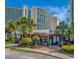 Charming Starbucks Coffee shop situated in a building complex featuring outdoor seating and lush landscaping at 7200 N Ocean Blvd. # 314, Myrtle Beach, SC 29572