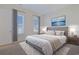 Serene main bedroom with plush bed and large windows at 822 Farrow Pkwy., Myrtle Beach, SC 29577
