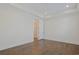 Simple bedroom with hardwood floors and access to hallway at 822 Farrow Pkwy., Myrtle Beach, SC 29577