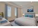 Spacious bedroom with a comfortable bed, large windows, and stylish decor at 822 Farrow Pkwy., Myrtle Beach, SC 29577