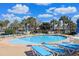 Relaxing community pool with plenty of lounge chairs and umbrellas at 822 Farrow Pkwy., Myrtle Beach, SC 29577