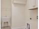 Laundry room with utility sink and built-in shelving at 822 Farrow Pkwy., Myrtle Beach, SC 29577