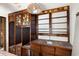 Dark wood bar with shelving and a small sink at 9095 Highway 701 South, Conway, SC 29527
