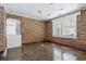 Unfinished basement room with brick walls and concrete floors at 9095 Highway 701 South, Conway, SC 29527