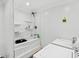 Small bathroom with shower/tub combo and washer/dryer at 9095 Highway 701 South, Conway, SC 29527