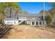 Back of house with detached garage and fenced pool area at 9095 Highway 701 South, Conway, SC 29527