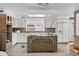 White kitchen cabinets and brick-accented island at 9095 Highway 701 South, Conway, SC 29527