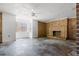 Living room featuring a brick fireplace and concrete flooring at 9095 Highway 701 South, Conway, SC 29527