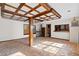 Spacious living room with exposed wooden beams and hardwood floors at 9095 Highway 701 South, Conway, SC 29527