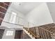 Indoor staircase with ornate railing leading to the upper level at 9095 Highway 701 South, Conway, SC 29527