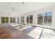 Bright sunroom with wall-to-wall windows and concrete floor at 9095 Highway 701 South, Conway, SC 29527