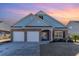 Brick home with a two-car garage and a landscaped front yard at 92 Preservation Dr., Myrtle Beach, SC 29572