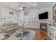 Living room with a fireplace, hardwood floors, and ample natural light at 92 Preservation Dr., Myrtle Beach, SC 29572