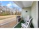 Screened-in patio with outdoor furniture and grill at 94 Vineyard Place # 11, Pawleys Island, SC 29585