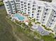 Aerial view of the outdoor pool and amenity area nestled between condo buildings at 9400 Shore Dr. # 311, Myrtle Beach, SC 29572