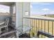 Outdoor balcony seating area with views of marsh, Intracoastal Waterway, and coastline at 9400 Shore Dr. # 311, Myrtle Beach, SC 29572