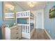 Comfortable bedroom featuring a bunk bed, soft blue walls, and beach-themed decor for a cozy and relaxing atmosphere at 9400 Shore Dr. # 311, Myrtle Beach, SC 29572