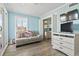 Light and airy bedroom with sofa, TV and bunk beds behind the door at 9400 Shore Dr. # 311, Myrtle Beach, SC 29572