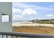 Stunning balcony view showcasing the beach, Intracoastal Waterway, and shoreline at 9400 Shore Dr. # 311, Myrtle Beach, SC 29572