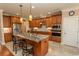 Gourmet kitchen boasts granite island and wood cabinets at 9486 Carrington Dr., Myrtle Beach, SC 29579