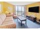 Living room with sofa, chair, coffee table, and ocean view at 9550 Shore Dr. # 1721, Myrtle Beach, SC 29572