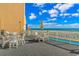 Oceanfront patio with tables and chairs for dining at 9550 Shore Dr. # 1721, Myrtle Beach, SC 29572