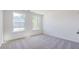 Empty bedroom with carpet, a double window, and white trim at 123 Tbd Sun Colony Blvd., Longs, SC 29568