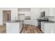 Modern kitchen featuring granite countertops, stainless steel appliances, and white cabinets at 123 Tbd Sun Colony Blvd., Longs, SC 29568