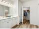 Bathroom features double sinks, modern fixtures, and a closet for easy storage and organization at 124 Tbd Sun Colony Blvd., Longs, SC 29568
