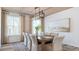 Formal dining room featuring a modern chandelier, a large window, and seating for eight guests at 124 Tbd Sun Colony Blvd., Longs, SC 29568