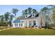 Lovely two-story home with a manicured lawn and DRB Homes signage on display at 124 Tbd Sun Colony Blvd., Longs, SC 29568