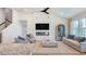 Open-concept living room with vaulted ceilings, electric fireplace, neutral tones, and hardwood flooring at 124 Tbd Sun Colony Blvd., Longs, SC 29568