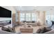 Bright living room featuring large windows, comfortable seating, modern fireplace, and stylish decor at 124 Tbd Sun Colony Blvd., Longs, SC 29568