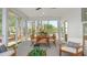 Relaxing screened-in porch with comfortable seating and views of the surrounding trees at 124 Tbd Sun Colony Blvd., Longs, SC 29568