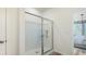 Bathroom showcasing a glass shower with modern fixtures, light walls and access to the main bedroom at 124 Tbd Sun Colony Blvd., Longs, SC 29568