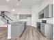 Bright eat-in kitchen with gray cabinets, granite countertops, and stainless appliances at 132 Joyce Dr, Longs, SC 29568